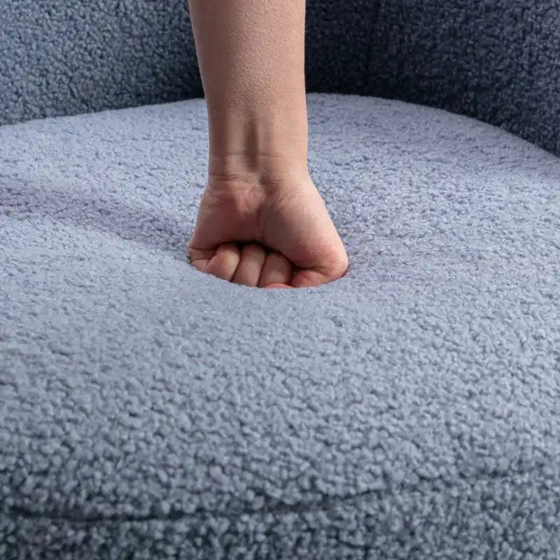 Fauteuil pivotant en tissu bouclette avec anneau en métal thermolaqué