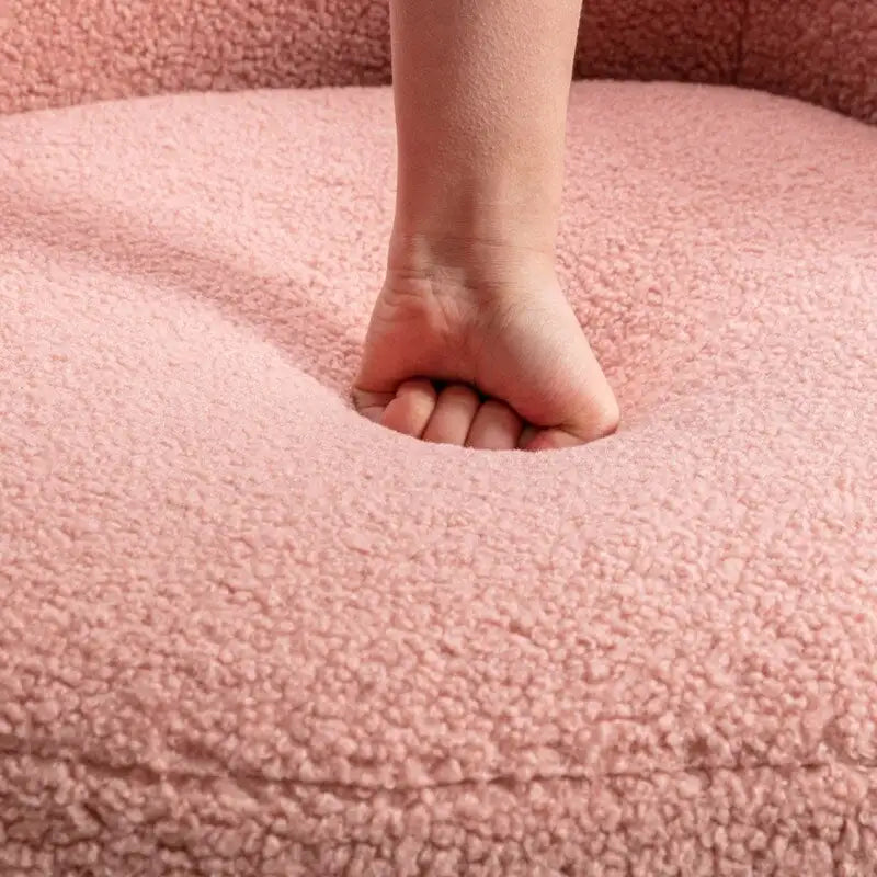 Fauteuil pivotant en tissu bouclette avec anneau en métal thermolaqué